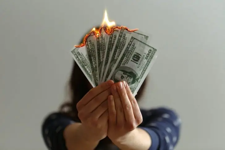 Is burning money illegal?